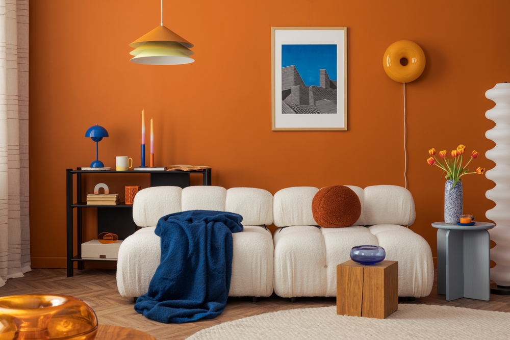 Modern,Cozy,Living,Room,With,White,Boucle,Sofa,,Orange,Wall